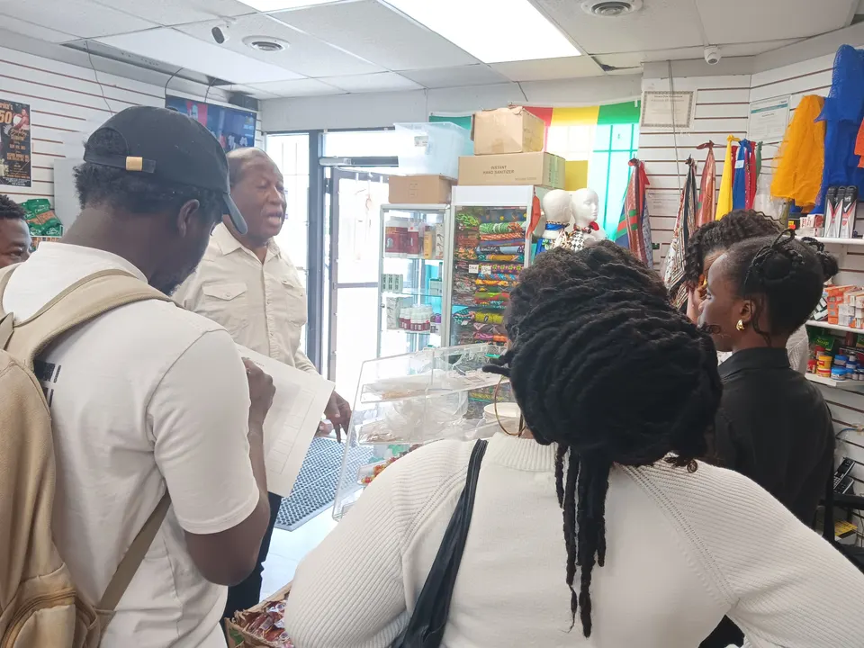 Wide view of a packed grocery aisle at Adepa